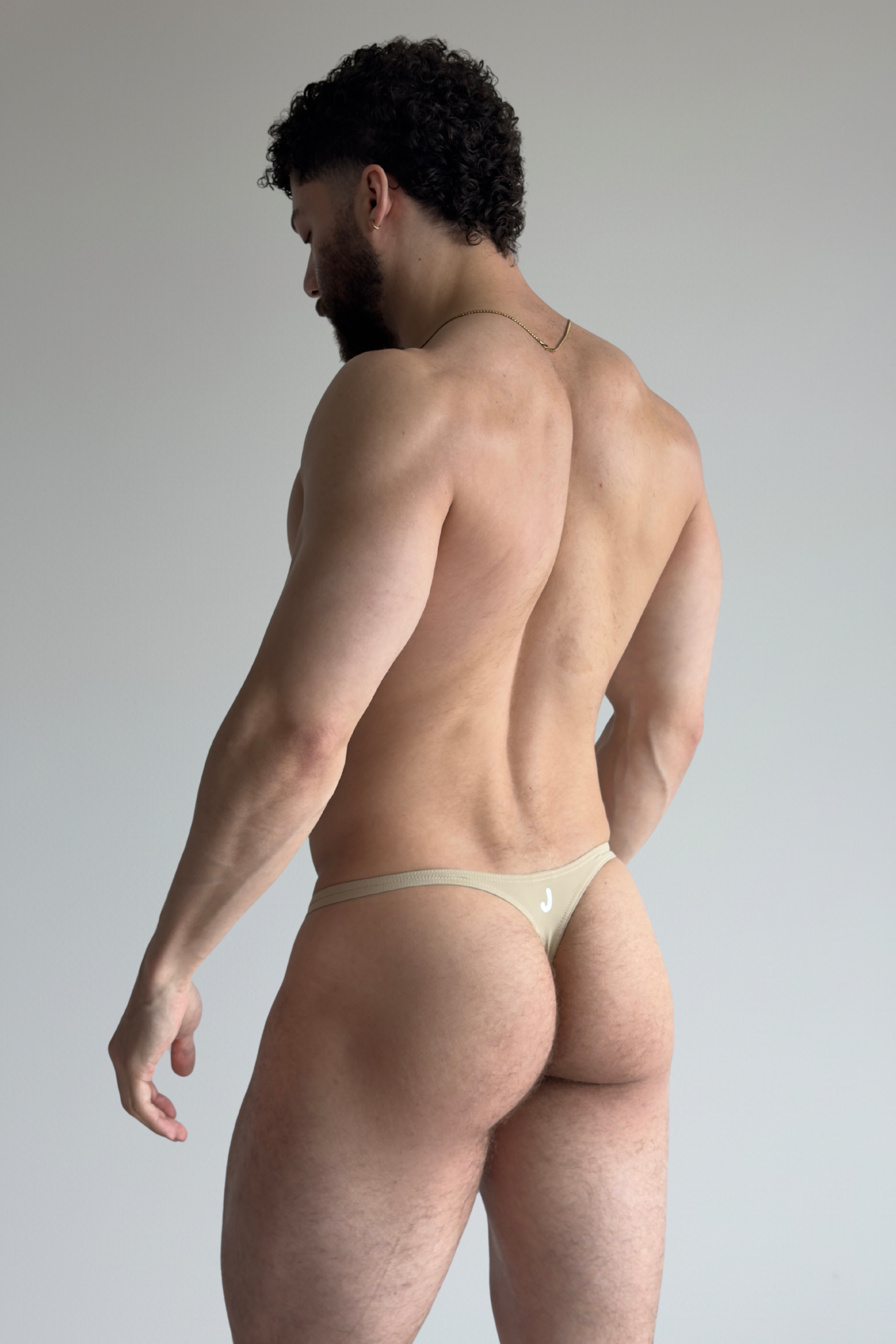 swim thong - sand